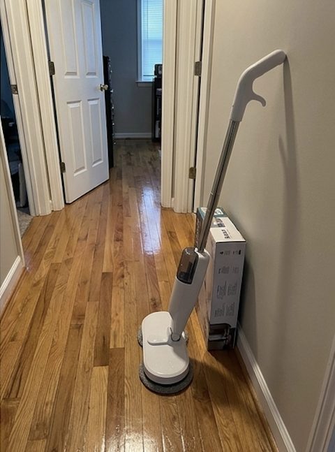 Customer photo: KleenMop resting in a hallway on hardwood floors