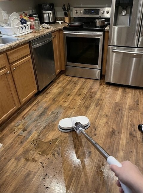 Customer photo: KleenMop mid-clean on a kitchen floor